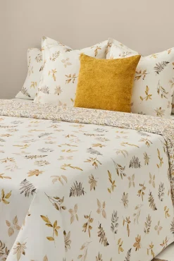 Textura Edredons-Capa de edredom de algodão com folhas em um galho cru